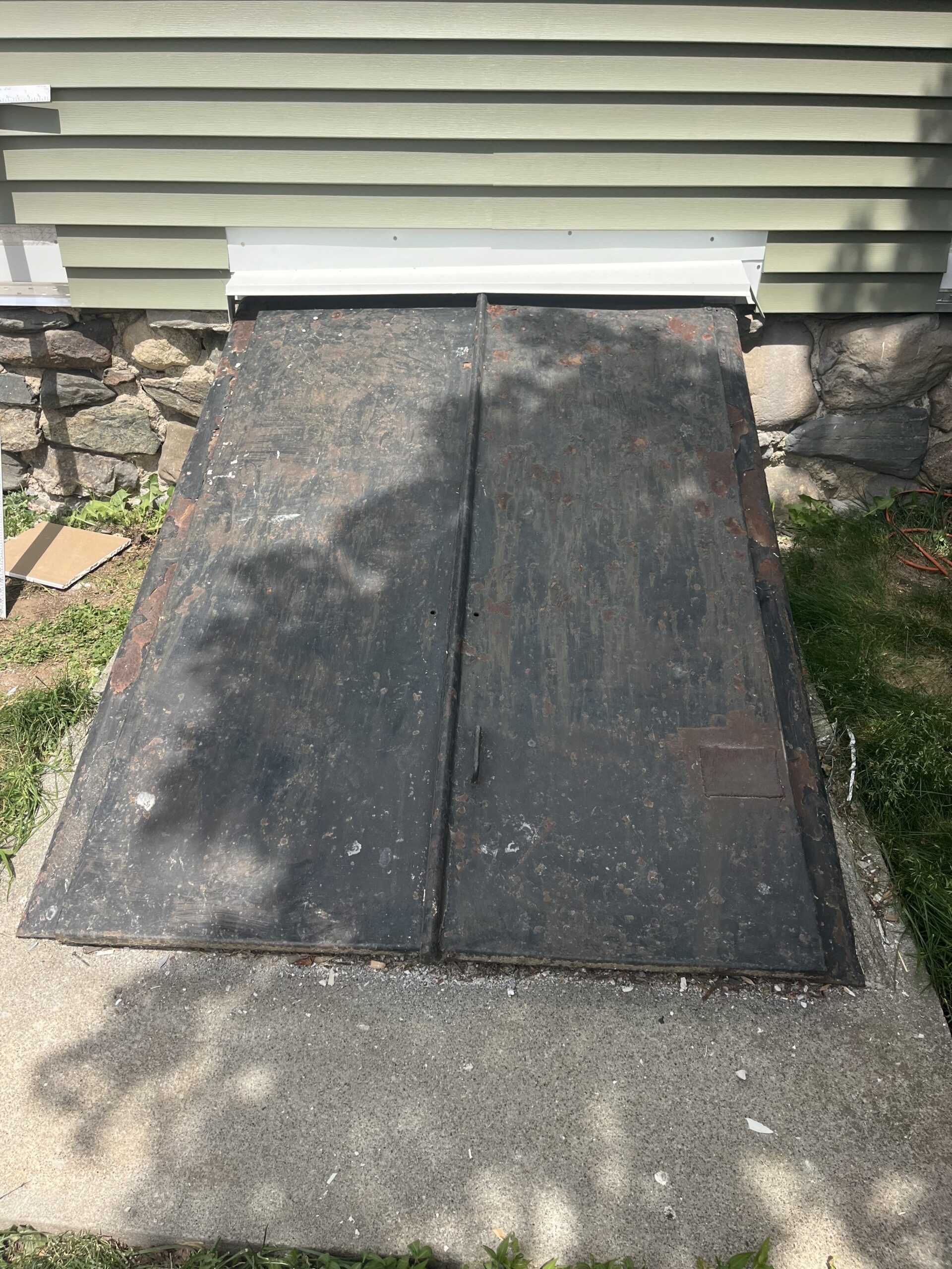 Old cellar doors being replaced at a home in Milford, CT